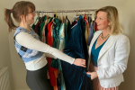 Kristy Adams and shopper looking through clothes